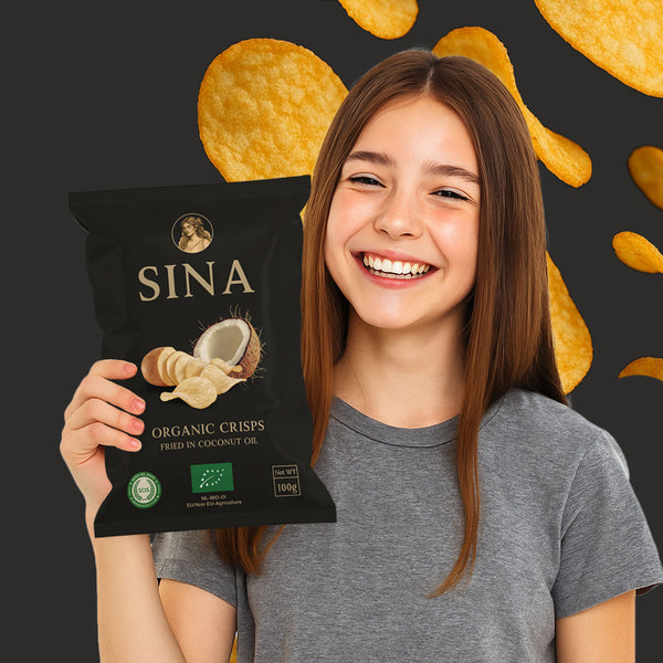 Person holding a SINA organic crisps packet with crisps in the background